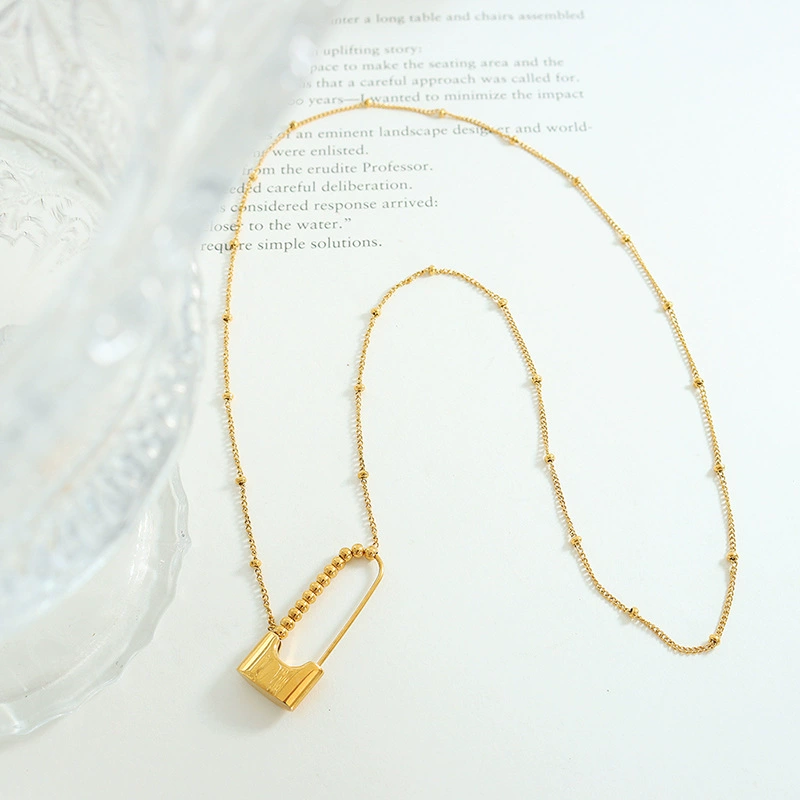 Minimalist Giada necklace with delicate gold chain and modern bobby pin pendant