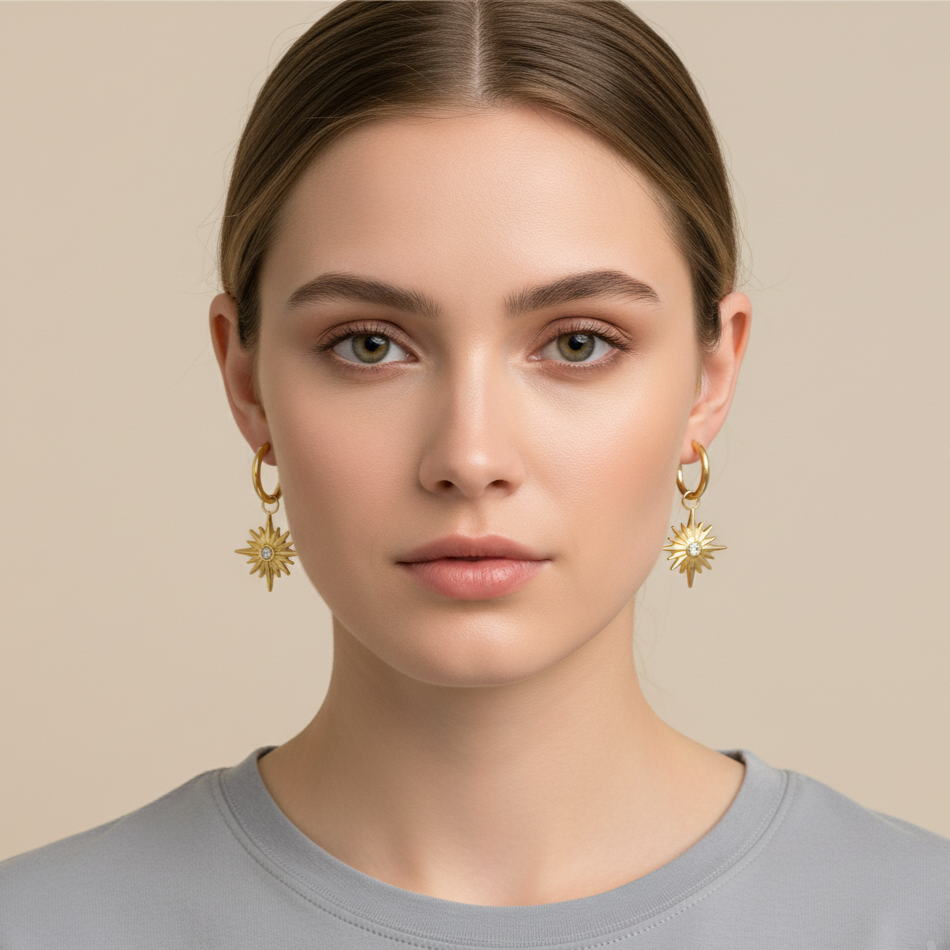 Gold hoop earrings with hexagon star charm and delicate stone