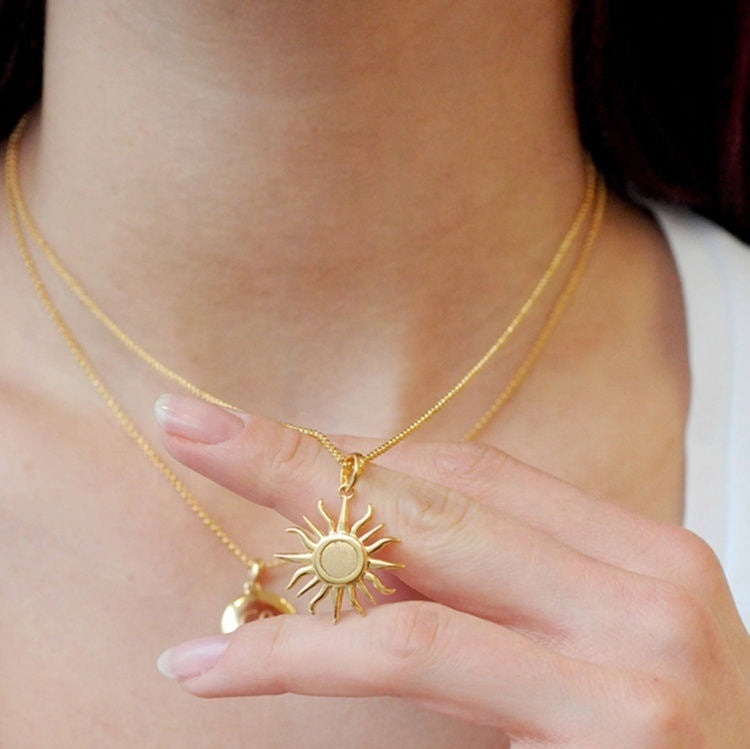 Celestial inspired gold necklace with detailed sun pendant, waterproof and durable jewelry