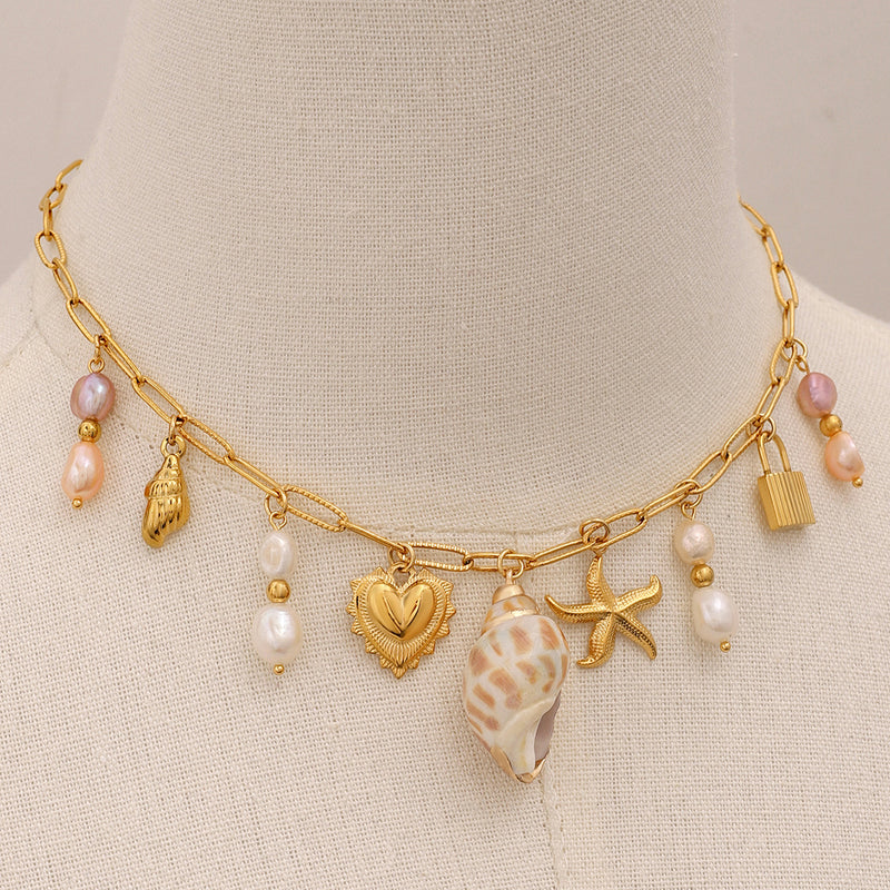 Freshwater pearl necklace with ocean-themed charms, perfect for beach or city wear